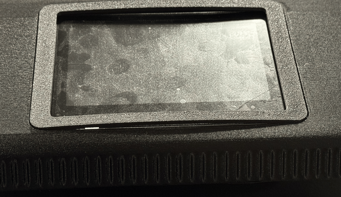 The printed front-top on 24 September, in black PET-GF with its fluted skin. The screen is the machine display, under the first snap-in cover, which lifts along its long edge.